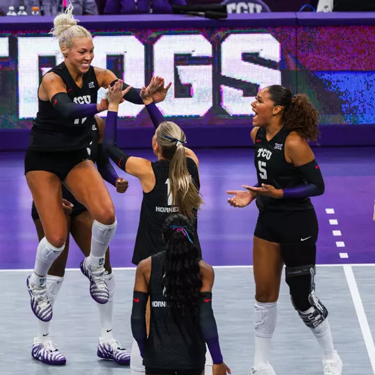 TCU Volleyball's Becca Kelley and Rosemary Archer celebrate a point against SMU