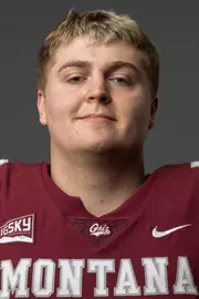 A football recruit takes photos.