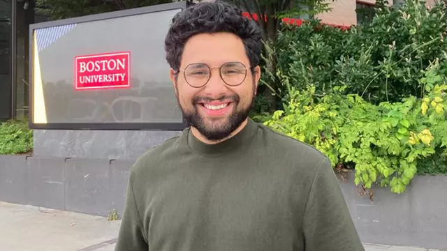 Dhruv Raman standing outside a Boston University building