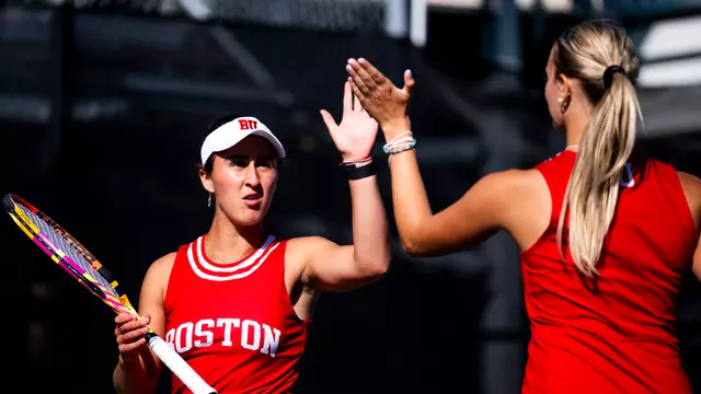 Women's tennis high five after a point