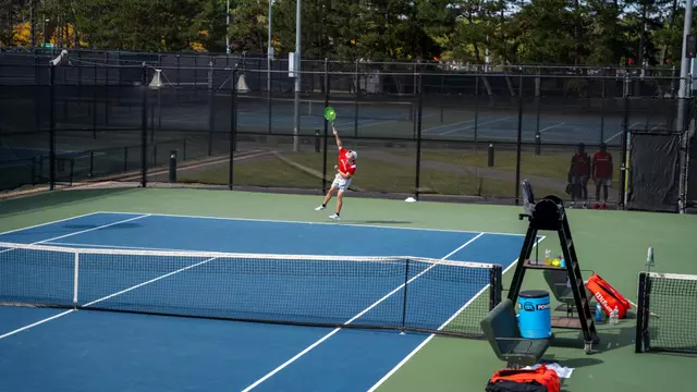 Andrew Andea hitting a serve at Harvard