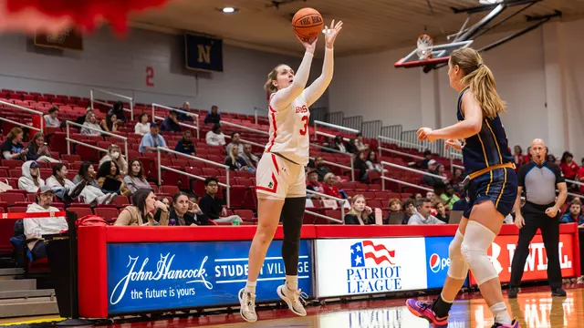 Photo of women's basketball senior Anastasiia Semenova shooting a three-pointer at Case Gym.