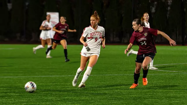Photo of BU women's soccer senior Margy Porta passing a ball at Nickerson Field.