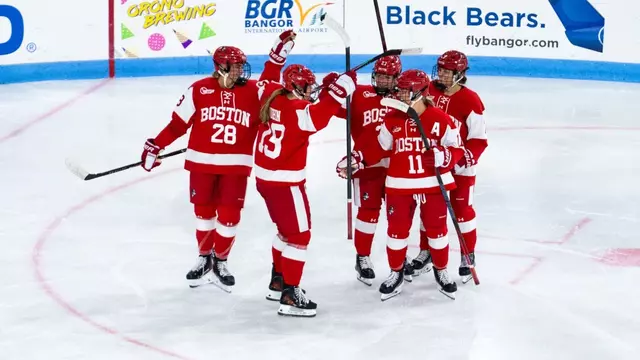women's ice hockey celebrates goal at Maine