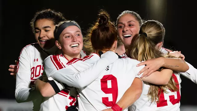 Photo of the BU Women's Soccer team celebrating a goal.