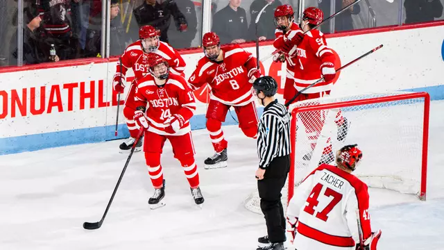 Boston University men's hockey players celebrate after scoring final goal at Matthews Arena