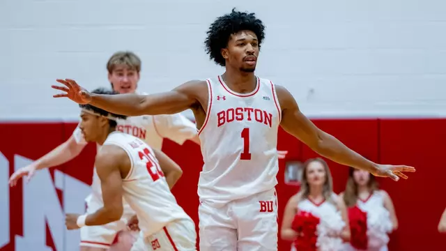 Ethan Okwuosa has arms spread out in defensive position.