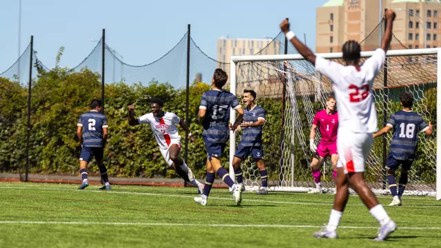 Dylan Williams and Ethan Gill are shown celebrating Andrea Di Blasio's goal with arms up in the air
