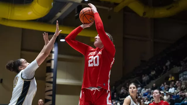 Photo of women's basketball senior Anete Adler shooting a jumper at Army West Point.
