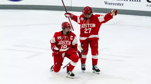 Neely Nicholson and Keira Healey celebrate scoring a goal at Holy Cross