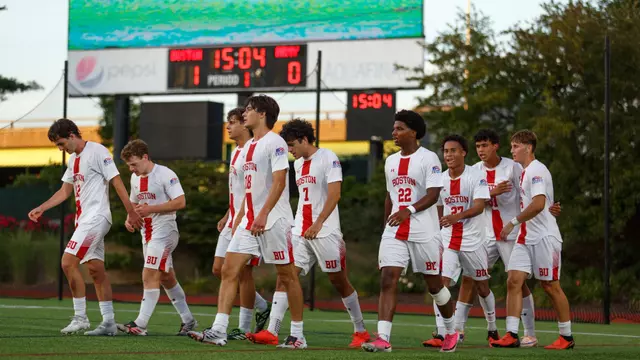 Men's soccer walks on the field at halftime