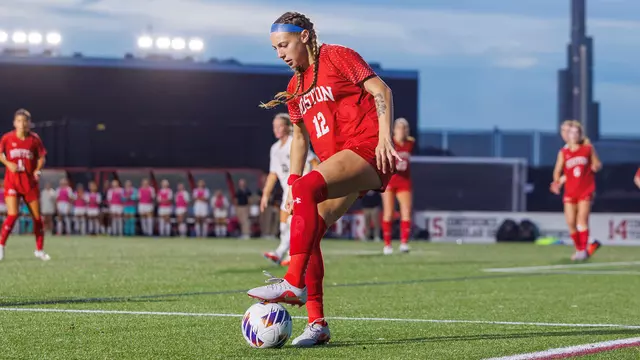 Photo of BU women's soccer junior Jaiden Schultz dribbling the ball at Nickerson Field.
