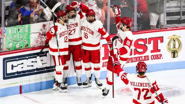 BU men's ice hockey players celebrate a goal against UConn