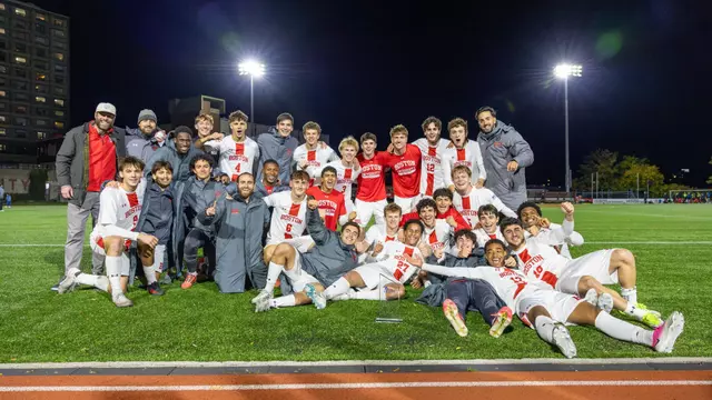 Men's soccer poses with Patriot League trophy