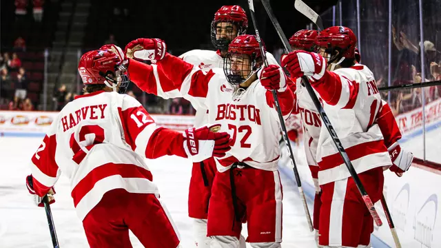 BU men's hockey players celebrate a goal against Maine