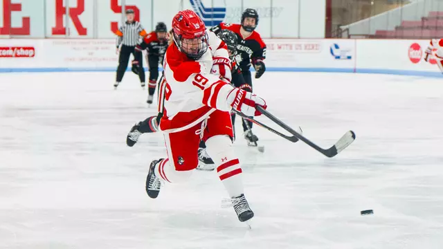 Clara Yuhn shooting the puck at Walter Brown Arena