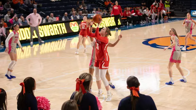 Photo of BU women's basketball senior Anastasiia Semenova shooting a layup at Bucknell.