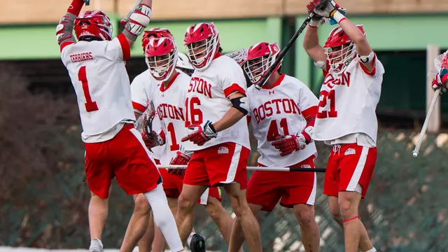 BU men's lacrosse players celebrate Donald Varnerin's goal against Dartmouth