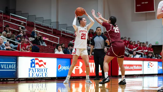 Photo of BU women's basketball junior Audrey Ericksen looking to pass the ball.