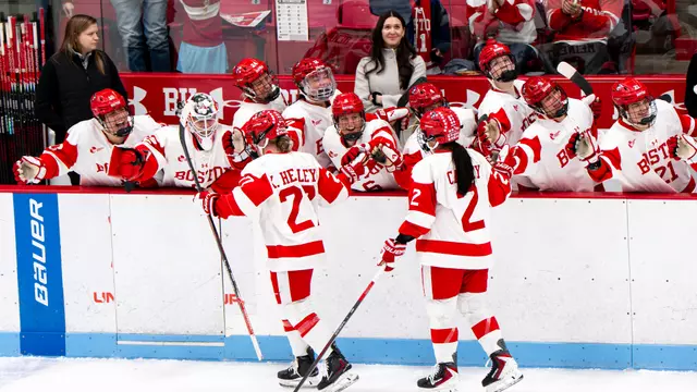 women's ice hockey bench high fives goal