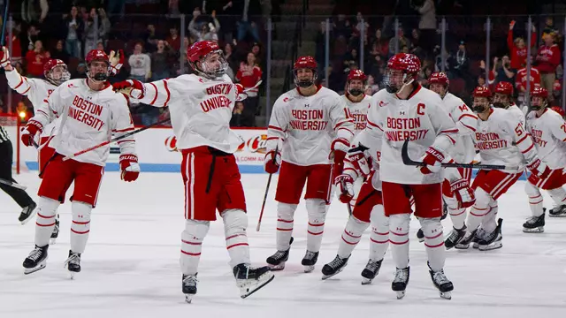 Ryder Ritchie celebrates with his teammates after his OT goal against Maine