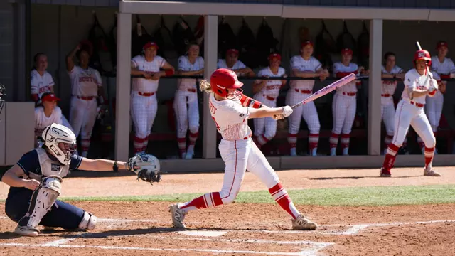 Kylie Doherty fully extends arms and bat while making contact on a pitch for an extra-base hit
