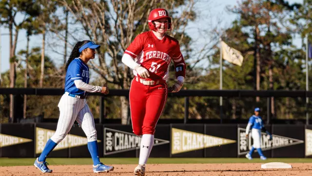 Kylie Doherty trots to home after hitting a solo homer against Duke