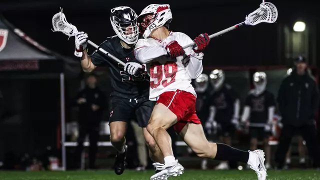 Andrew Pape about to take a shot while playing lacrosse against Harvard