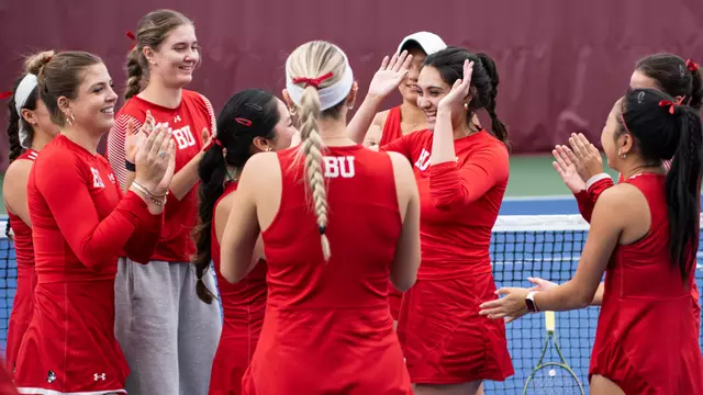 Women's tennis high fives before the match in a circle