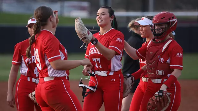 Kasey Ricard celebrates with teammates after a win at Harvard
