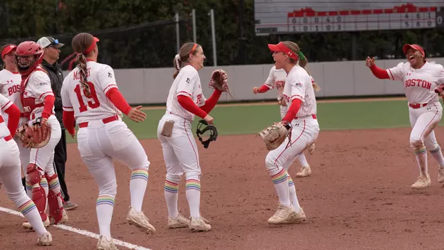 Haley Ganino is greeted by teammates after turning a double play
