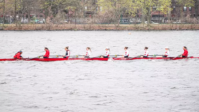 Photo of the BU Lightweight Rowing 8 racing on the Charles River.