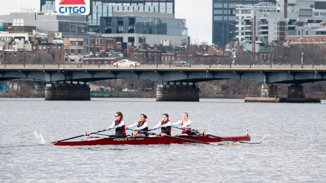 Photo of the BU Lightweight Rowing Varsity 4 racing on the Charles River.