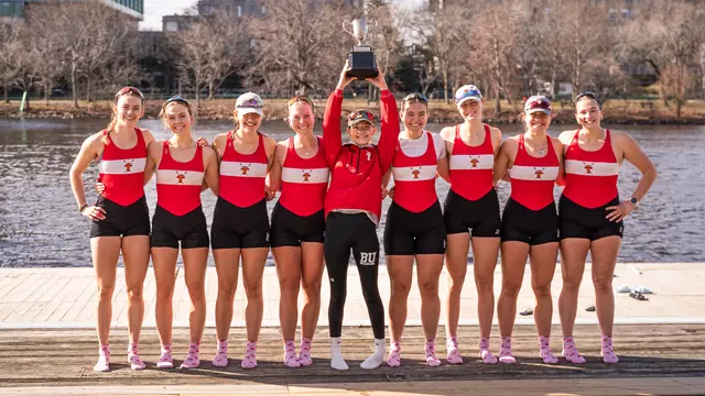 Women's Rowing Varsity 8+ Lifts the Council Cup on the dock of DeWolfe Boathouse