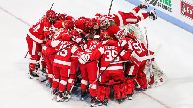 Women's ice hockey pre game huddle at the net