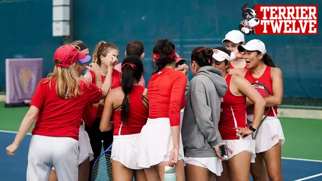 Women's Tennis huddles for a cheer after a match with the Terrier 12 Logo in the corner