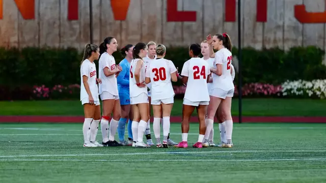 Women's soccer huddle on the field
