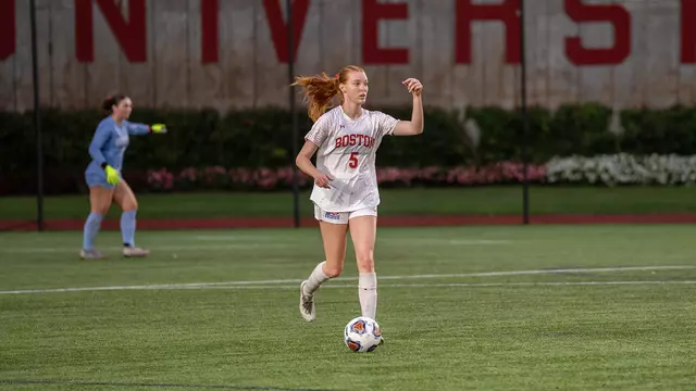 Photo of BU women's soccer senior Ciara Kennedy dribbling the ball.