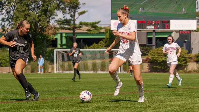 Photo of BU women's soccer senior Kat Slott dribbling the ball against Providence.