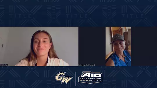 GW women's basketball alumna Cathy (Neville) Cranberg ('95) talks with Faith Blethen.