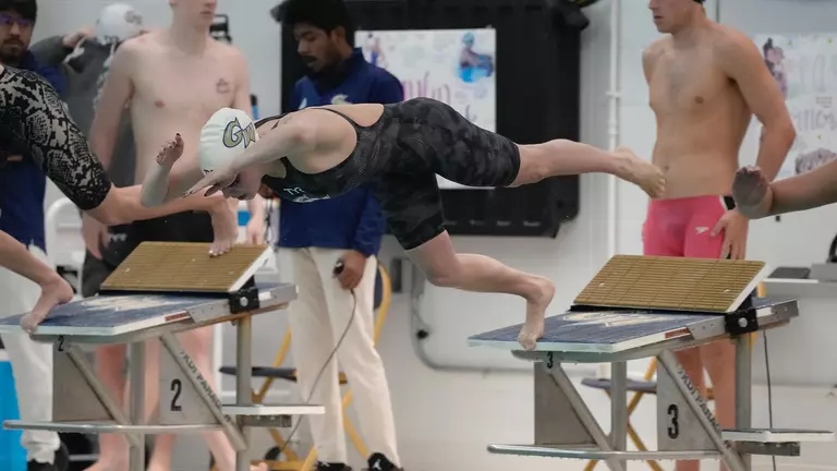 Swimming & Diving Cruises to Victories over UMBC