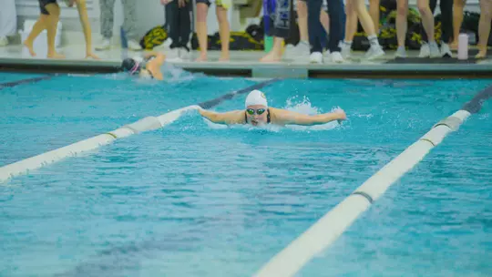 Ava Topolewski swimming at Smith