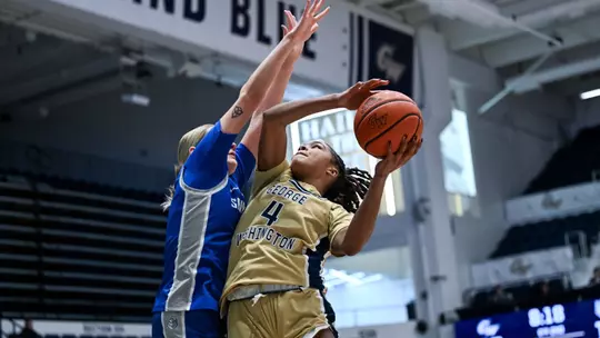 Sara Lewis Extends of a Saint Louis Defender for the Layup