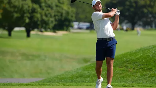 Evan Eichenlaub admires a drive