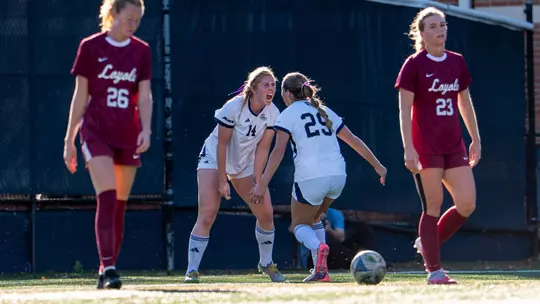 Kate McGrath and Isabelle Ohlmann Celebrate Goal vs. Loyola Chicago