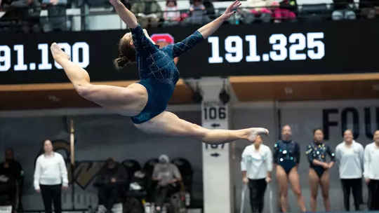 Deana Sheremeta performs on floor in the Smith Center