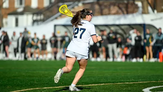 Grace Curry moves the ball into GW's attacking zone at the Vern