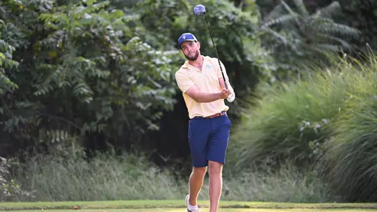 Evan Eichenlaub admires a drive