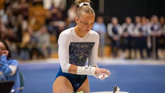 Lola Montevago prepares for bar routine at EAGL Championships