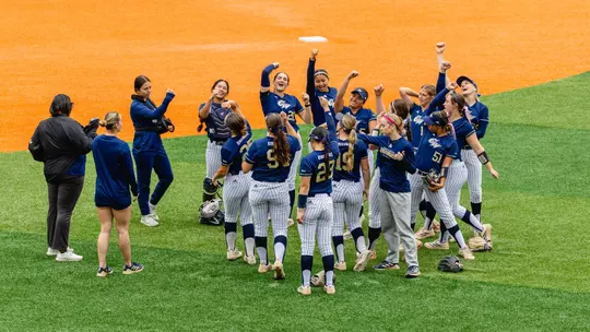 Softball team celebrating a victory